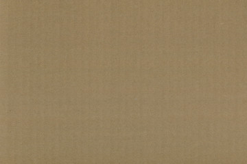 Close up grainy decorative light brown vintage rough sheet of carton. Cardboard paper texture blank background. Brown color old pattern empty papercraft surface. Recycled ecology friendly material.