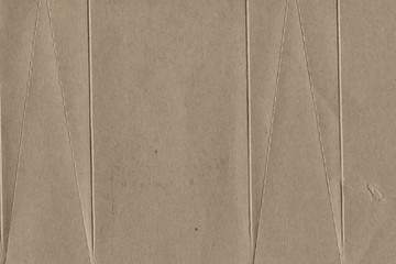 Close up grainy decorative light brown vintage rough sheet of carton. Cardboard paper texture blank background. Brown color old pattern empty papercraft surface. Recycled ecology friendly material.
