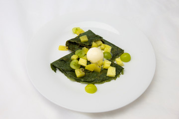 Green crepes with icecream, kiwi, pineapple and green grapes