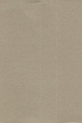 Fototapeta premium Close up grainy decorative light brown vintage rough sheet of carton. Cardboard paper texture blank background. Brown color old pattern empty papercraft surface. Recycled ecology friendly material.