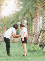 Happy romantic asian couple in love, Boyfriend take care of lover, Moments of happiness in the park.