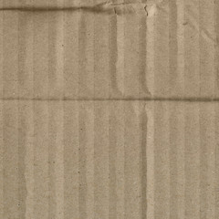 Fototapeta premium Close up grainy decorative light brown vintage rough sheet of carton. Cardboard paper texture blank background. Brown color old pattern empty papercraft surface. Recycled ecology friendly material.