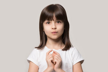 Adorable little curious girl hesitating asking questions.