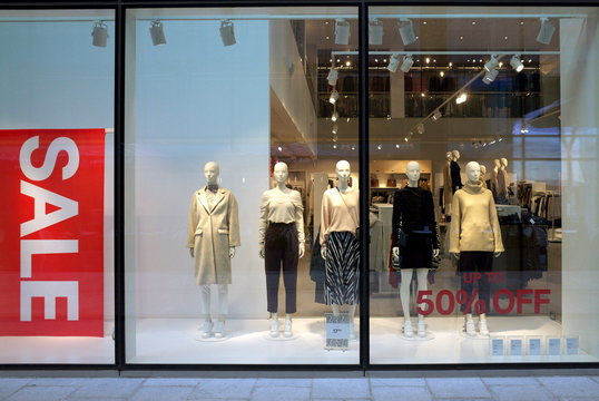Mannequins wearing female fashion clothing and a sale banner in the window of the H & M store on January 01, 2019 in Bracknell, England