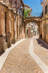 Fototapeta na wymiar Old cobblestoned street in historic town Alcaraz, Spain