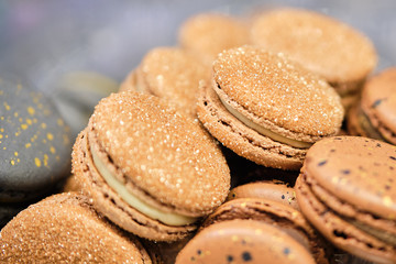 Delicious and beautiful brown and gray macaroons on sale.