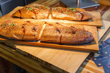 City Riga, Latvia. Street Restaurant food festival. Fish is grilled on the grill.