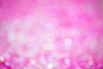 Pink-raspberry abstract background with bokeh. Festive background. Concept of magic, holiday, birthday. Template for design. 