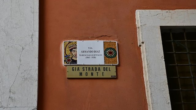 Ravenna, Italy, December 2019. Plaque in square Armando Diaz: celebrating the magnificent mosaics of the city, the signs of the streets of the historic center are embellished with this art form.