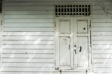 Obraz na płótnie Canvas Antique Old wooden window in community.
