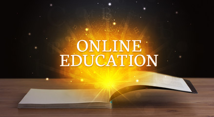 ONLINE EDUCATION inscription coming out from an open book, educational concept