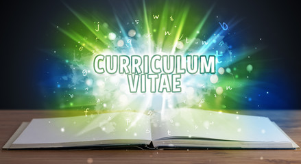 CURRICULUM VITAE inscription coming out from an open book, educational concept
