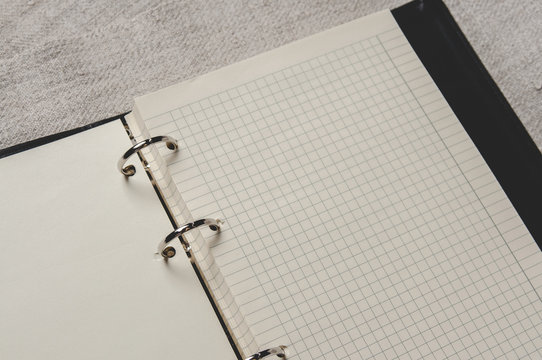 Notebook with pages in a cell. Blank page of open notebook
