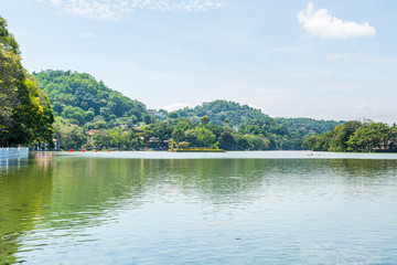 Kandy Lake or Kiri Muhuda or the Sea of Milk, an artificial lake in the heart of the hill city of Kandy, Sri Lanka, built in 1807 by King Sri Wickrama Rajasinghe next to the Temple of the Tooth.