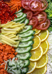 Different raw shredded vegetables and fruits as an example of a healthy diet