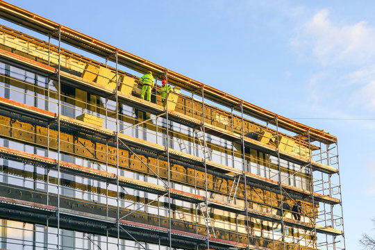 Scaffolding Arround The House To Install Thermal Insulation Of The Apartment Building Facade