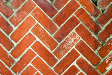 close up of diagonal herringbone brick wall pattern