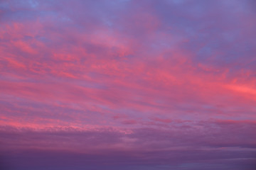 Naklejka na ściany i meble Sunset sky red clouds background