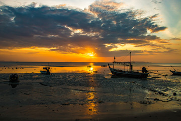 Fototapeta na wymiar Fishing boat and evening clouds on sunset, Koh Samui, Lipa Noi beach,Thailand