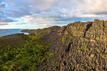 Fototapeta premium pristine secluded uninhabited island with unique rock formation/ tsingy of madagascar aerial panorama shot/ nosy hara