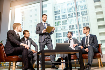group of young business people, caucasian leaders men hold conference, gathered togetehr in modern office, communicate and discuss. successful business people concept