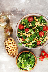 chickpea salad with ingredient and tomatoes and lamb´s lettuce. healthy salad