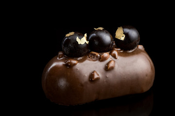 Artisan Monoportion Cake. Handmade Chocolate Dessert. Creative Patisserie. Black Background