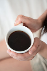 asian young woman drink coffee on sofa