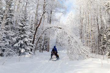 Athletes on a snowmobile.