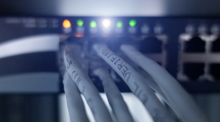 Ethernet cable on network switches background 