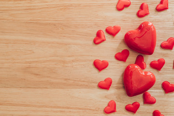 Top view red heart on wood table background with copy space.