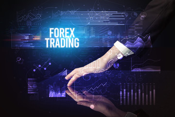 Businessman touching huge screen with FOREX TRADING inscription, cyber business concept