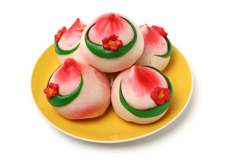 Traditional Chinese birthday bun named Shou Bao served on birthdays on white background
