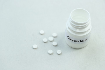 Oxycodone tablets. Opioid pain medication concept.