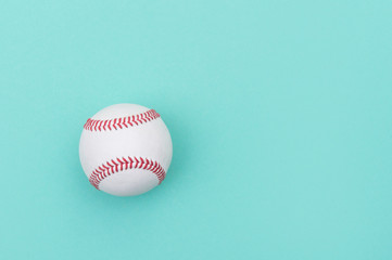 Baseball ball on green background.