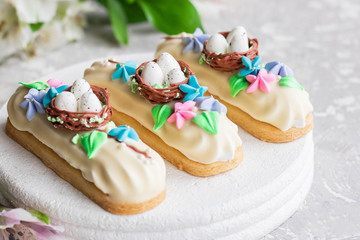Fototapeta na wymiar Chocolate Marshmallows Eclairs with Easter Decor