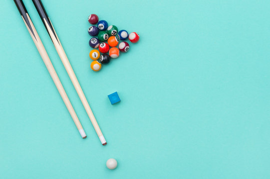 Pool Billiard equipments on a green background.