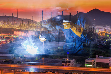 Double Exposure of Welder is Welding Pipeline Fabrication Assembly on Oil and Gas Refinery Manufacturing Plant Background. Technician Welding in Safety Protective Equipment is Working Metalwork.