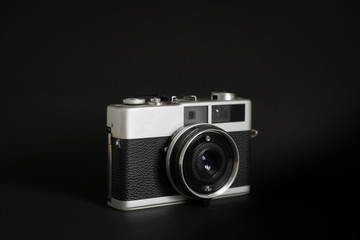Vintage camera in black background 