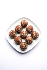 Aliv Laddu, Halim Ladoo or Garden cress Seed sweet Balls a very nutritious food in winters or for New Moms. popular food from India. served in a bowl or plate