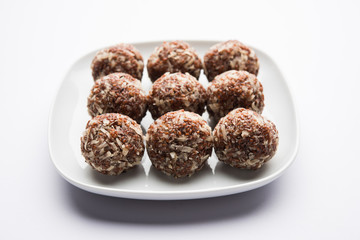 Aliv Laddu, Halim Ladoo or Garden cress Seed sweet Balls a very nutritious food in winters or for New Moms. popular food from India. served in a bowl or plate