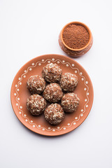 Aliv Laddu, Halim Ladoo or Garden cress Seed sweet Balls a very nutritious food in winters or for New Moms. popular food from India. served in a bowl or plate