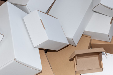 Many white and brown cardboard boxes, close-up