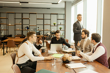 people hold conference at office. Business executive delivering presentation to colleagues or business partners during meeting or in-house business training, explaining business plans