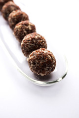 Aliv Laddu, Halim Ladoo or Garden cress Seed sweet Balls a very nutritious food in winters or for New Moms. popular food from India. served in a bowl or plate