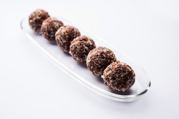 Aliv Laddu, Halim Ladoo or Garden cress Seed sweet Balls a very nutritious food in winters or for New Moms. popular food from India. served in a bowl or plate