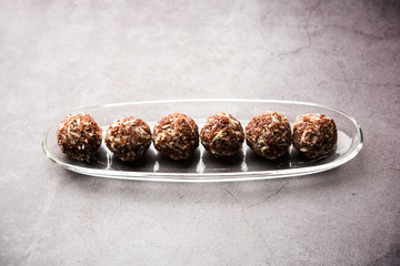 Aliv Laddu, Halim Ladoo or Garden cress Seed sweet Balls a very nutritious food in winters or for New Moms. popular food from India. served in a bowl or plate
