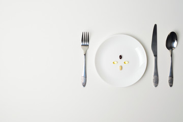 Table set with tablets. Multivitamin and mineral supplements. Meal replacement.Copy space. Astaxanthin.