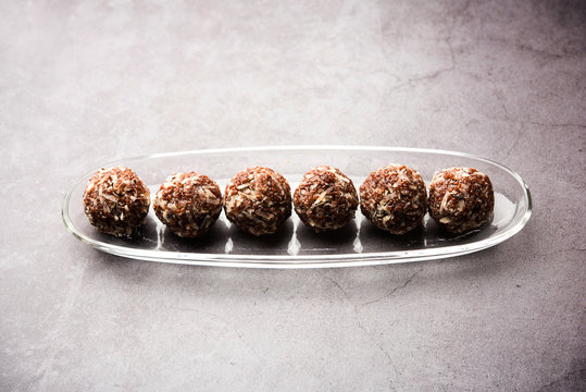 Aliv Laddu, Halim Ladoo or Garden cress Seed sweet Balls a very nutritious food in winters or for New Moms. popular food from India. served in a bowl or plate