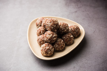 Aliv Laddu, Halim Ladoo or Garden cress Seed sweet Balls a very nutritious food in winters or for New Moms. popular food from India. served in a bowl or plate